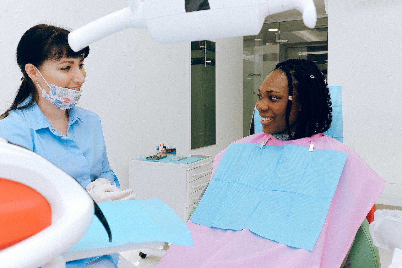 Patient undergoing sedation dentistry treatment, smiling comfortably in the dental chair at the Calgary clinic.